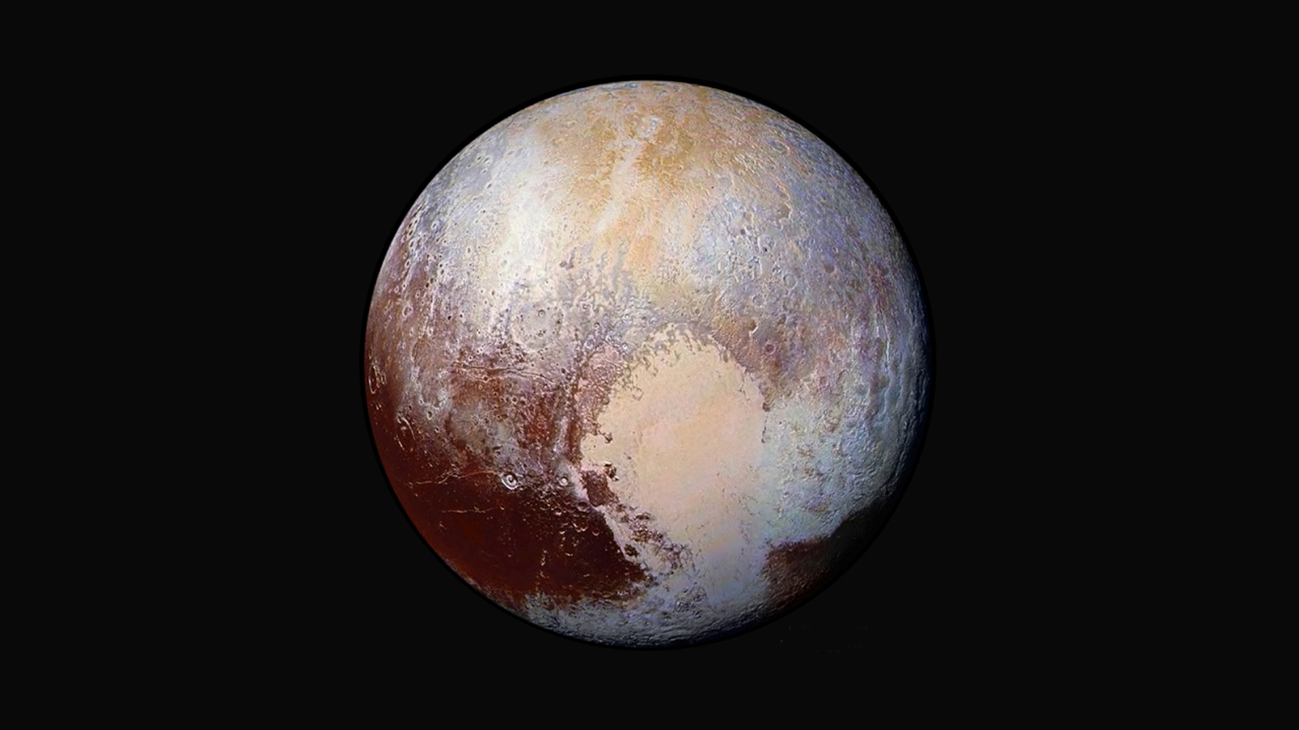 Figure 1: Iconic image – the enhanced-colour portrait of Pluto taken by New Horizons’ Long Range Reconnaissance Imager (LORRI) from a distance of 450,000 km (280,000 miles). Centred on the ‘heart’ of Tombaugh Regio, it shows features as small as 2.2 km (1.4 miles). Four images were combined with colour data from the Ralph instrument to create this view. Credit: NASA/JHUAPL/SwRI